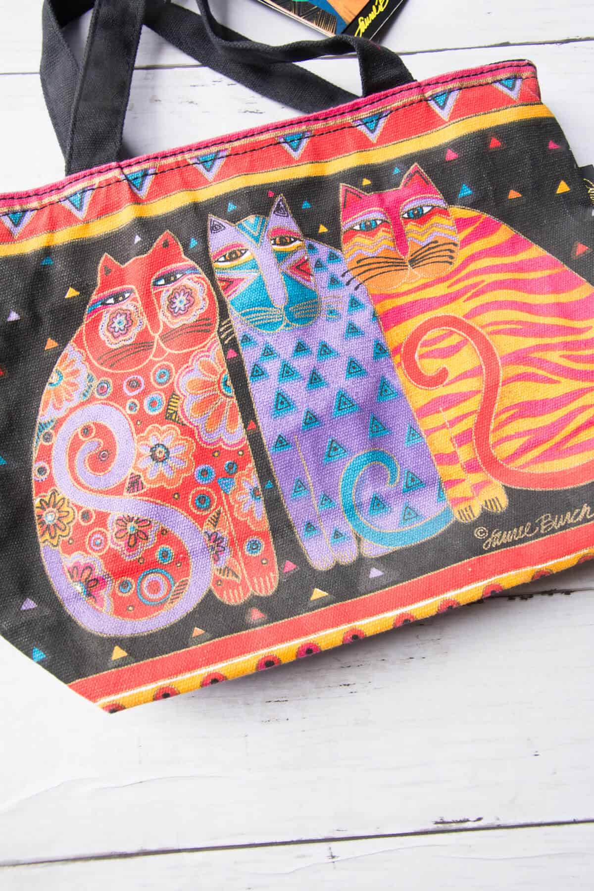 bag with colorful and patterned cats on it done by Laurel Burch.