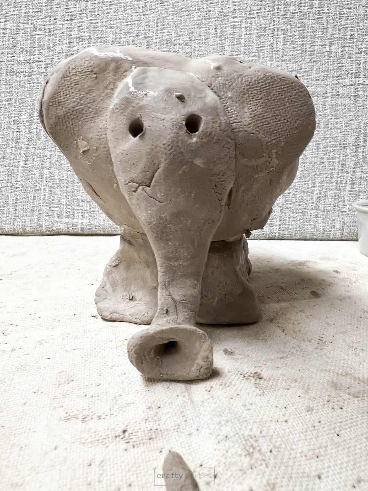 Clay elephant with pinch pot body.