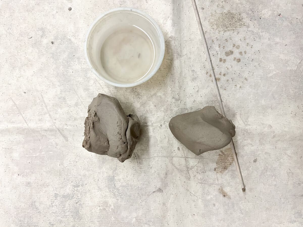 amount of clay used to build a clay owl with kids and small water container.