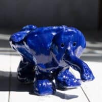 clay elephant pinch pot art project in blue glaze.