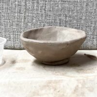 clay pinch pot bowl with added coil foot ring.