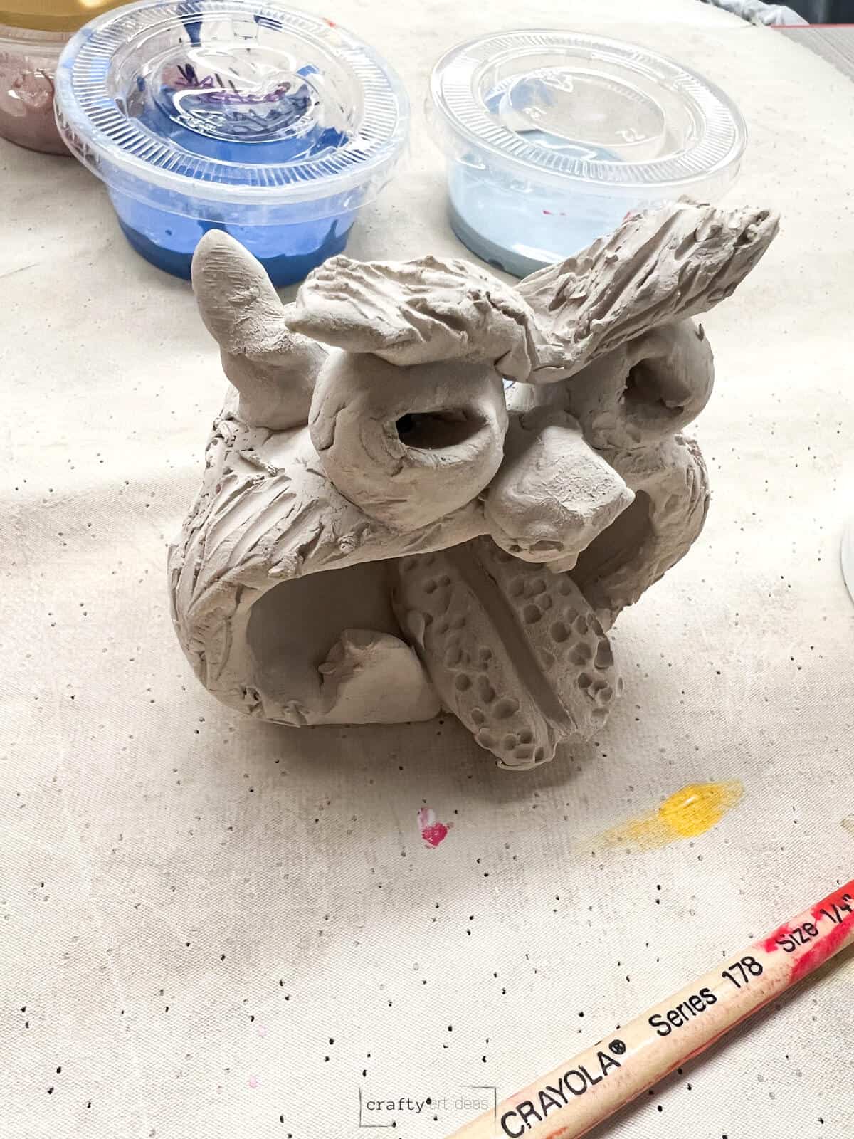 clay monster on a table.