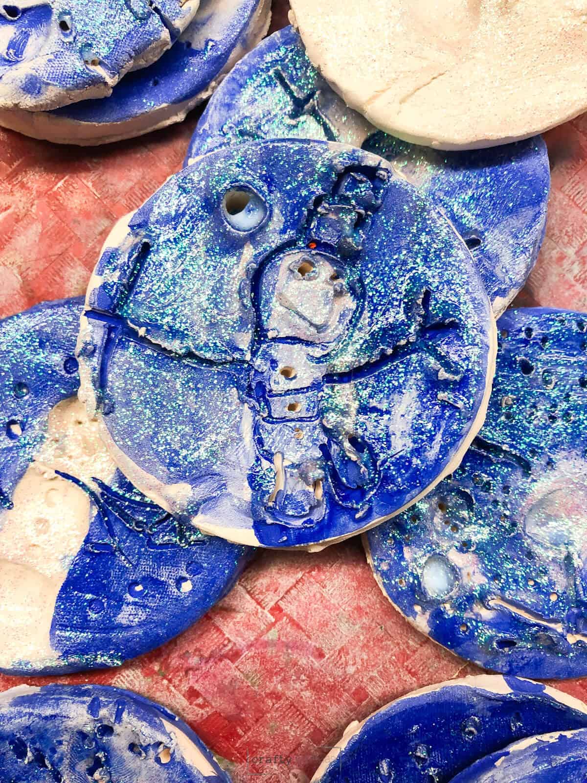 blue glitter snowman clay project for kindergartners.