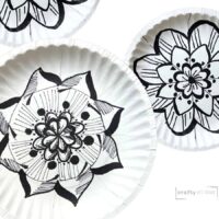 blakc and white radial designs on paper plates.