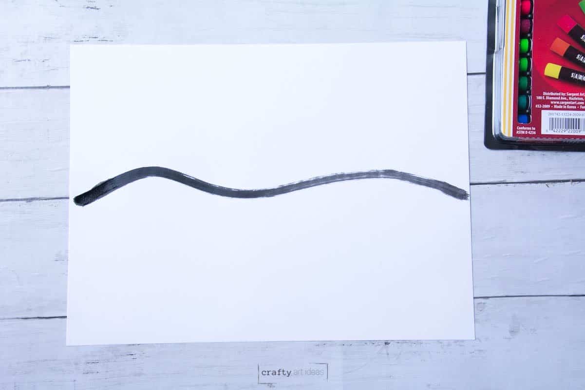black wavy line drawn across white paper.