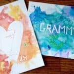 easy heart watercolor painting for kids in warm colors and cool colored painting saying "grammy".