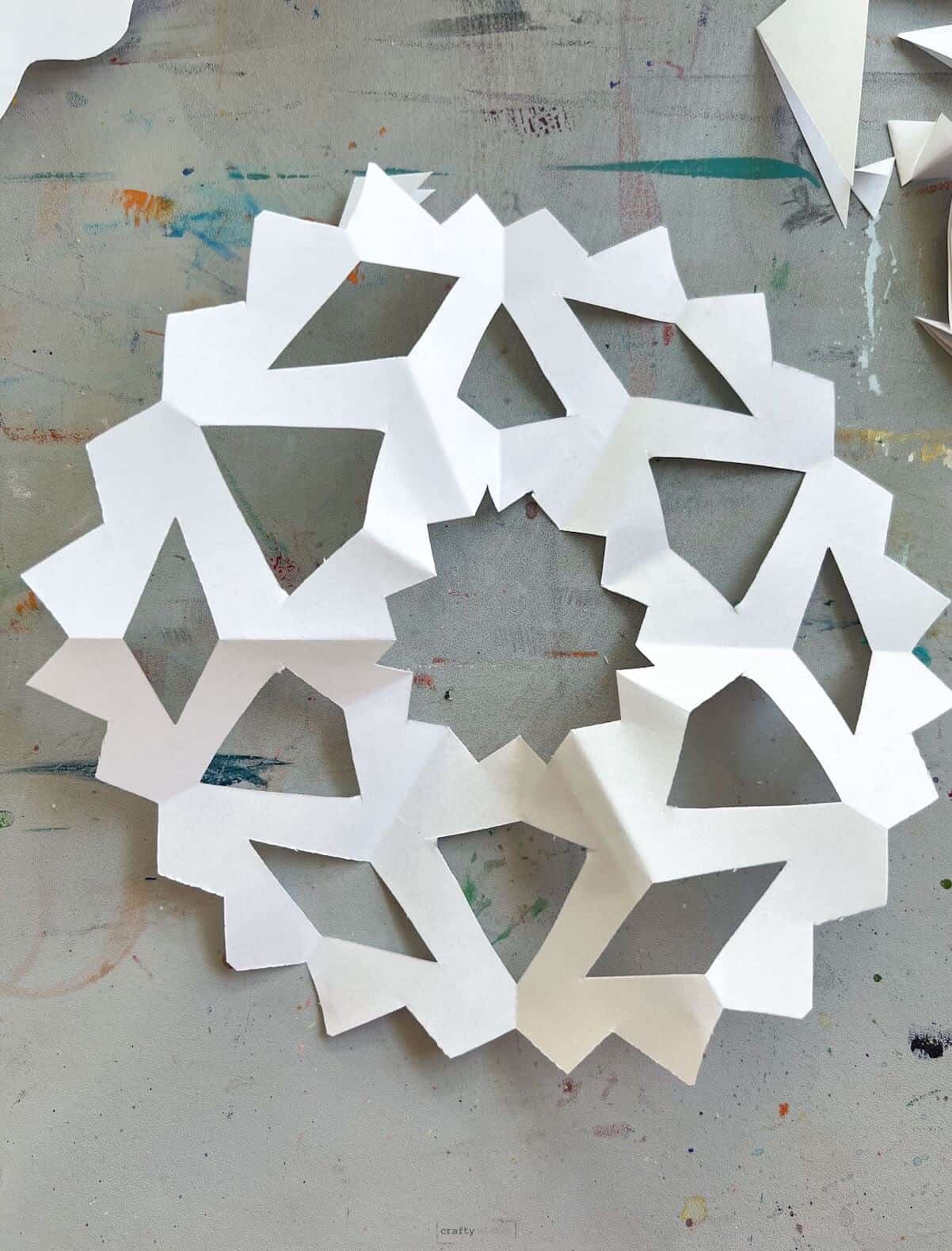 easy paper snowflake on table.