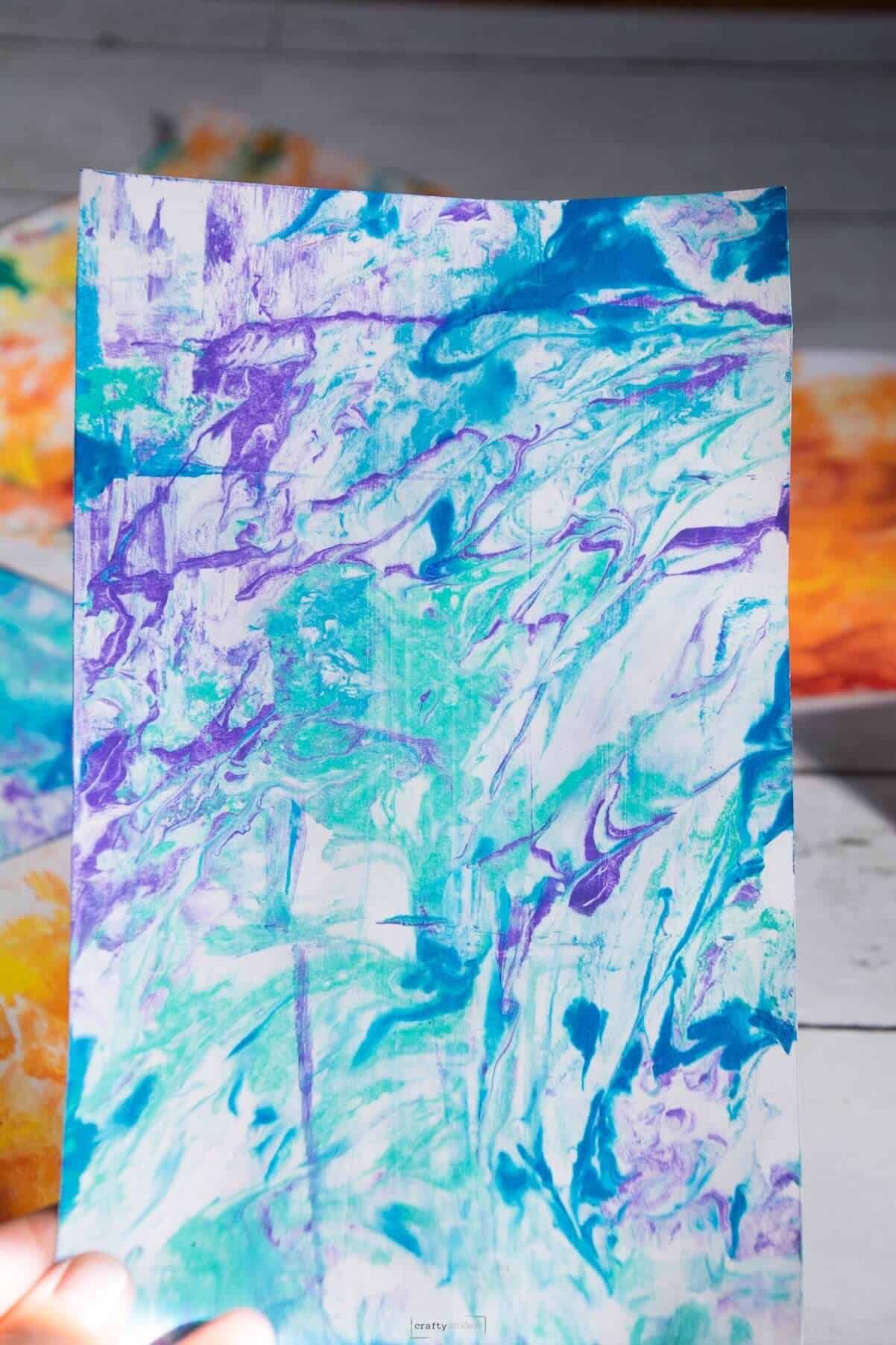 green, blue and purple marbled paper.