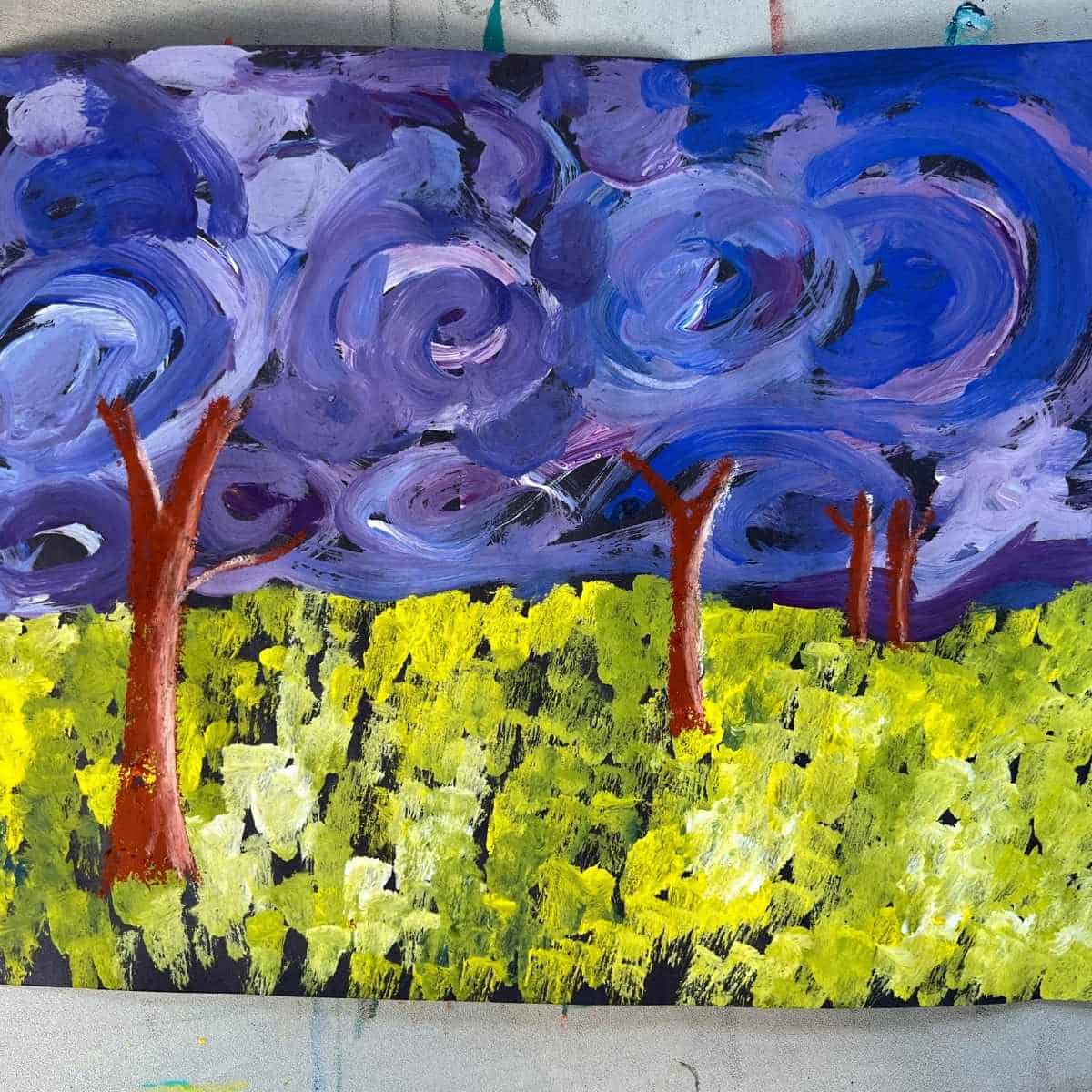 landscape painting on table with trees, grass and sky.