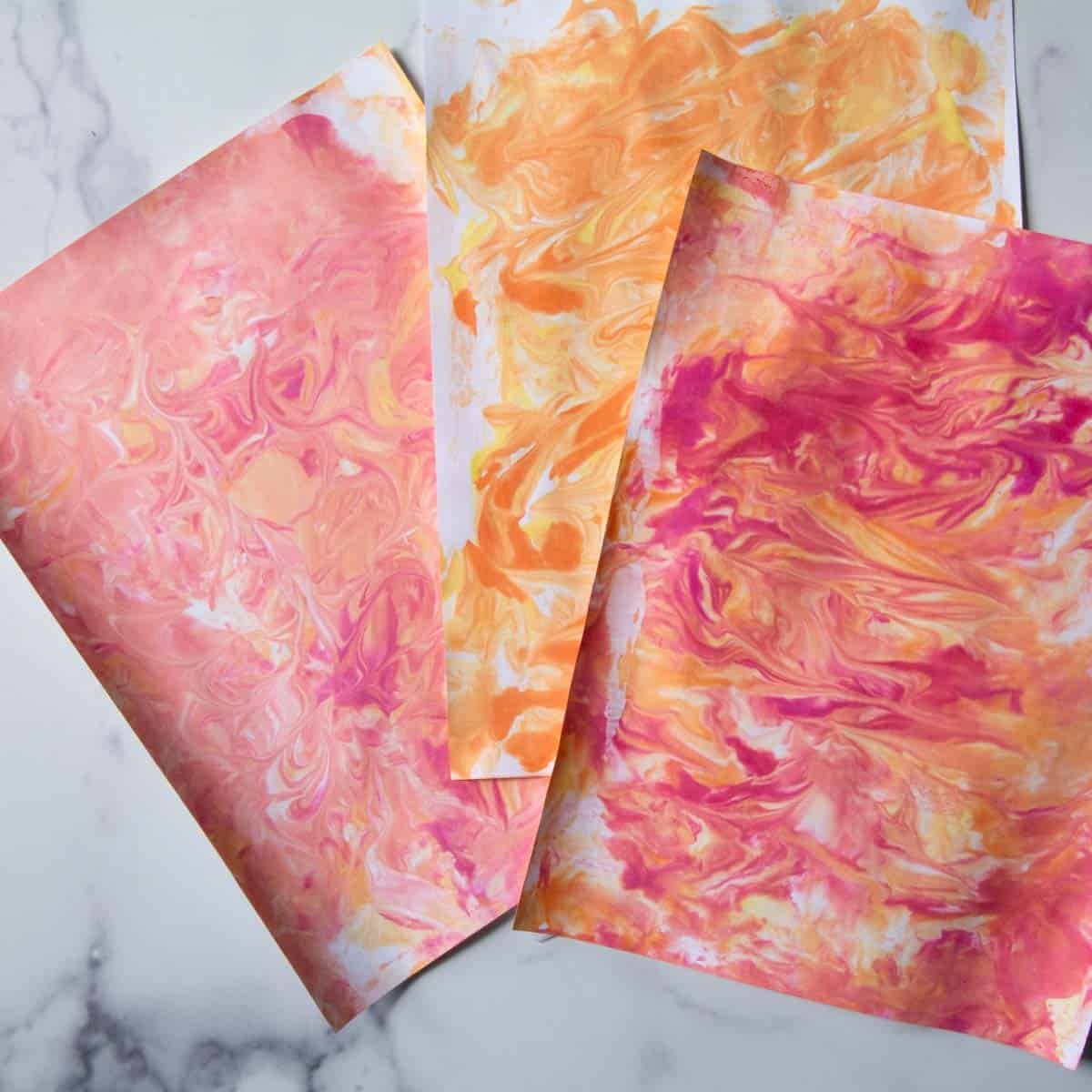 pink,orange marbled painted paper.