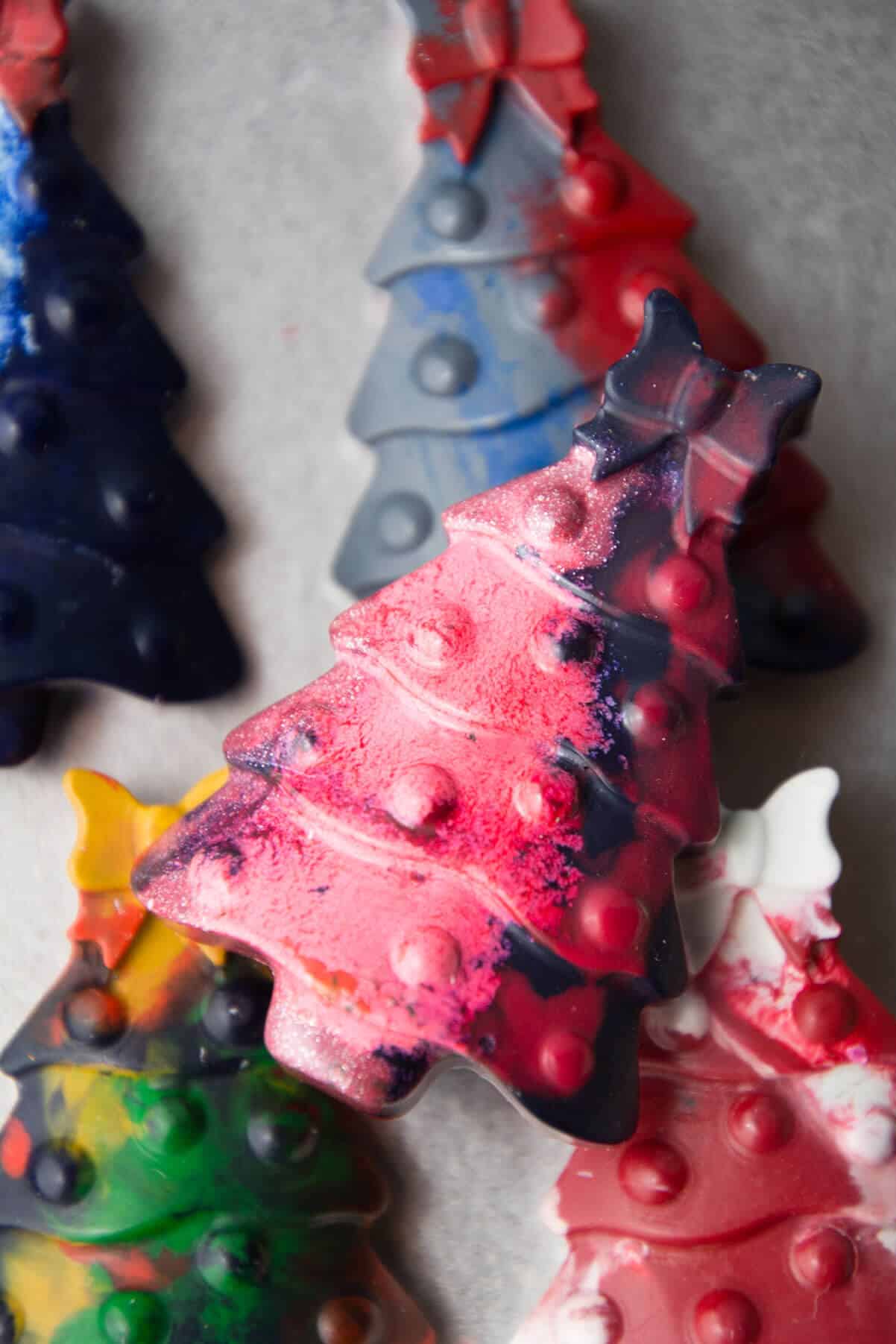 close-up view of pink, blue DIY Christmas tree crayon.