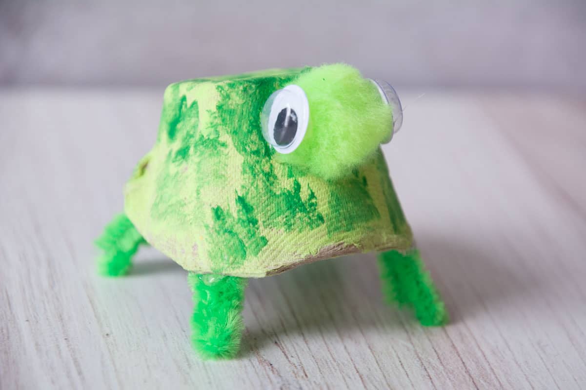cute kid turtle craft painted green made from egg carton, goggly eyes and pipe cleaners.