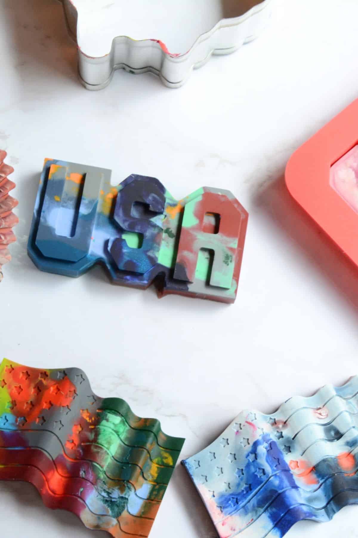 DIY USA crayons and USA flag crayons on a table.