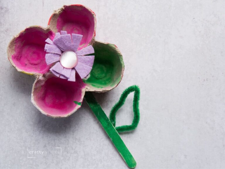 flower craft made from egg carton, button, craft stick and pipe cleaner.