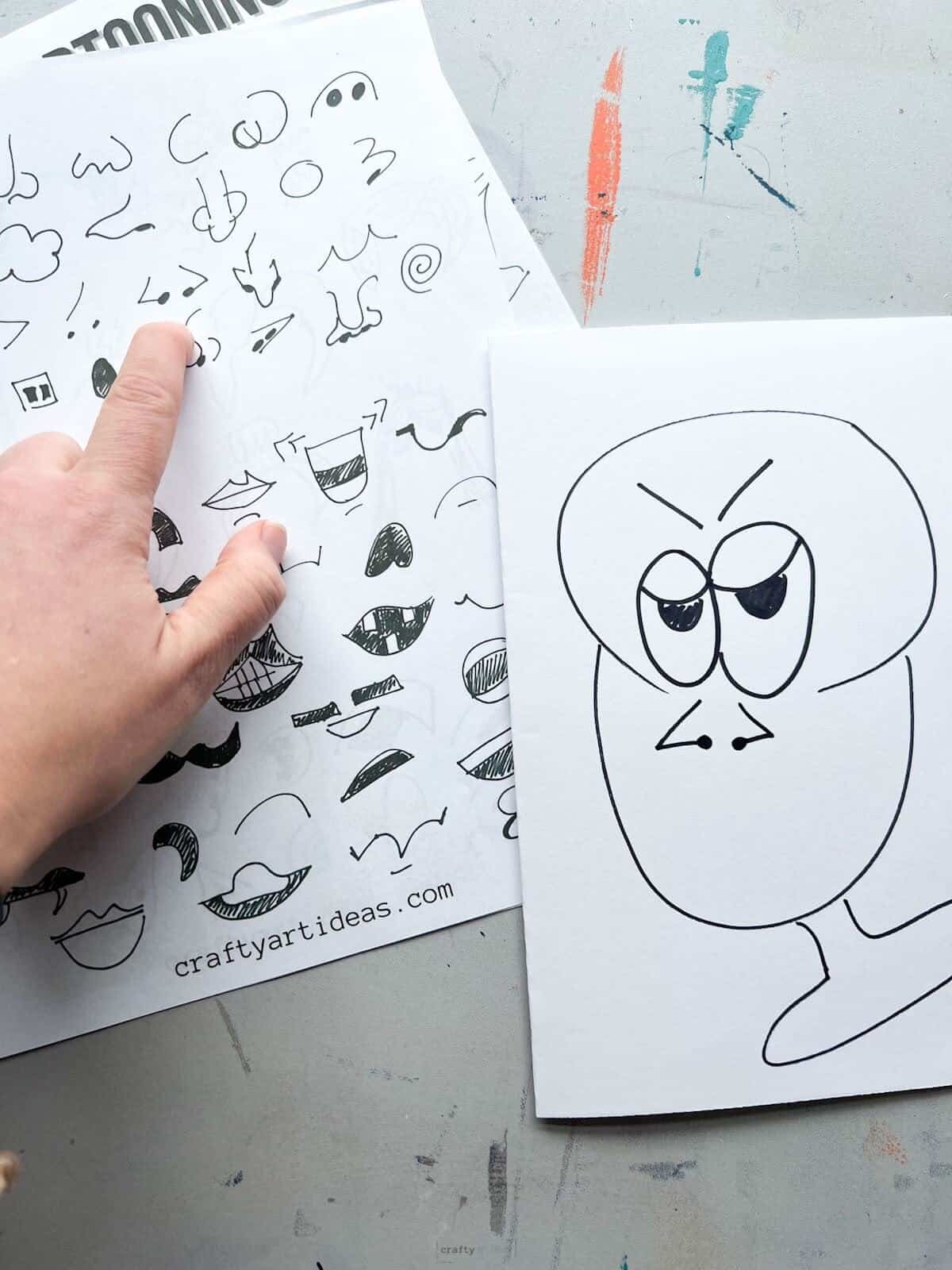 hand pointing to nose with cartoon head drawing with same nose.