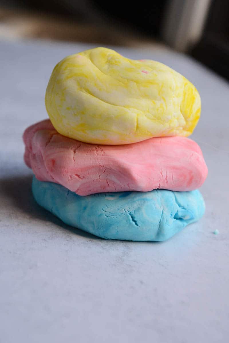 three stacks of clough dough on a table.