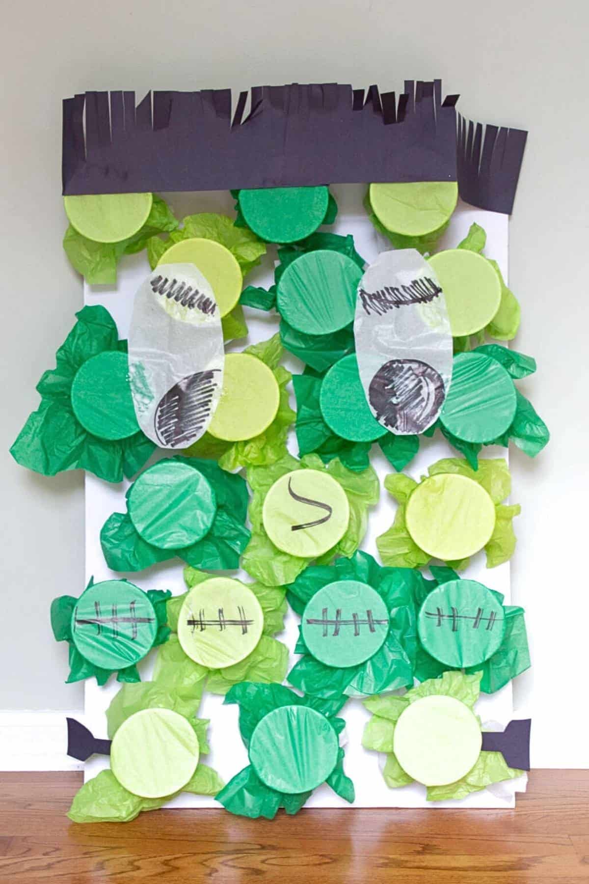 Frankenstein design made from plastic cups covered with green tissue paper.
