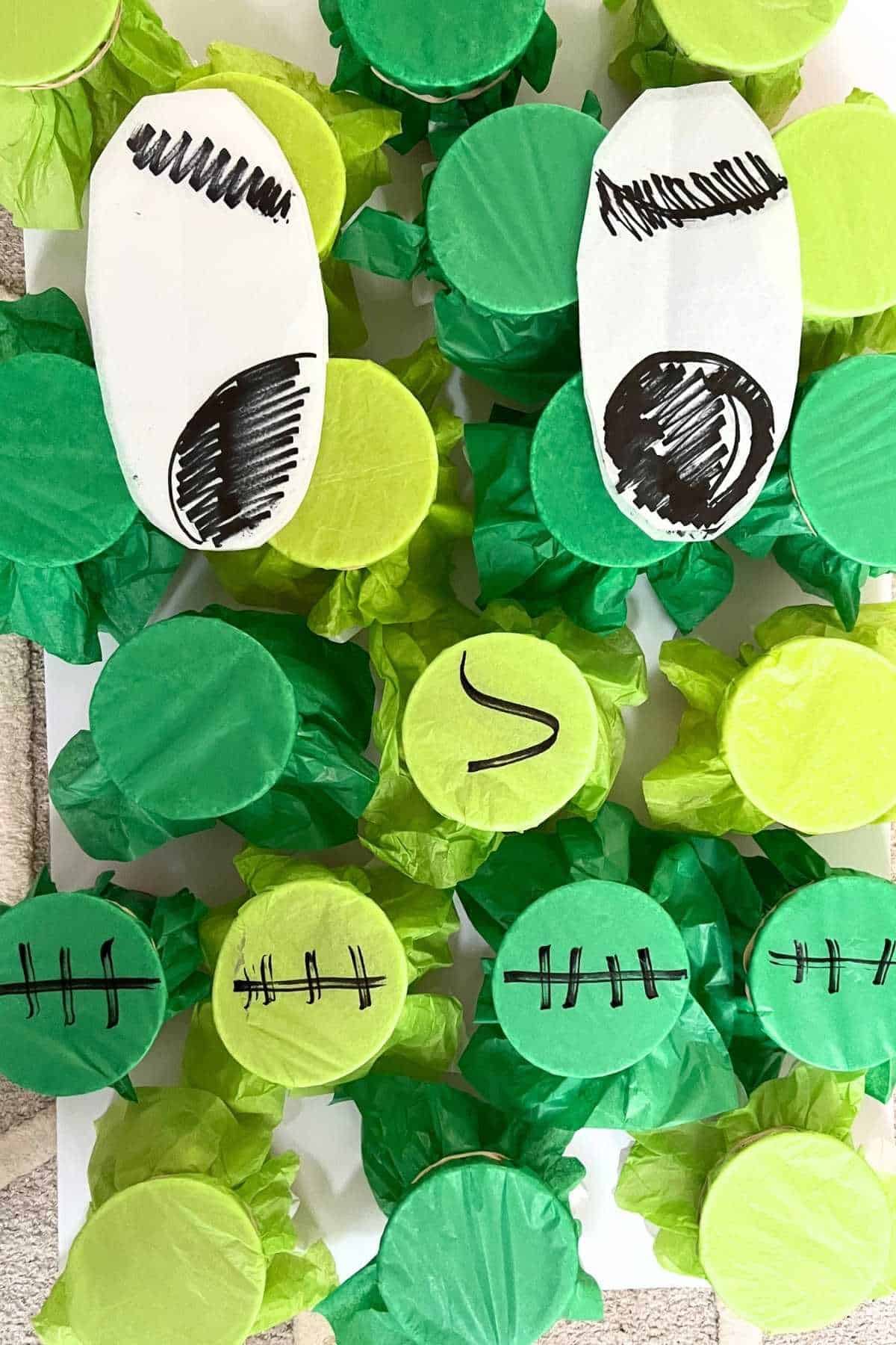 tissue paper on cups with Frankenstein design.