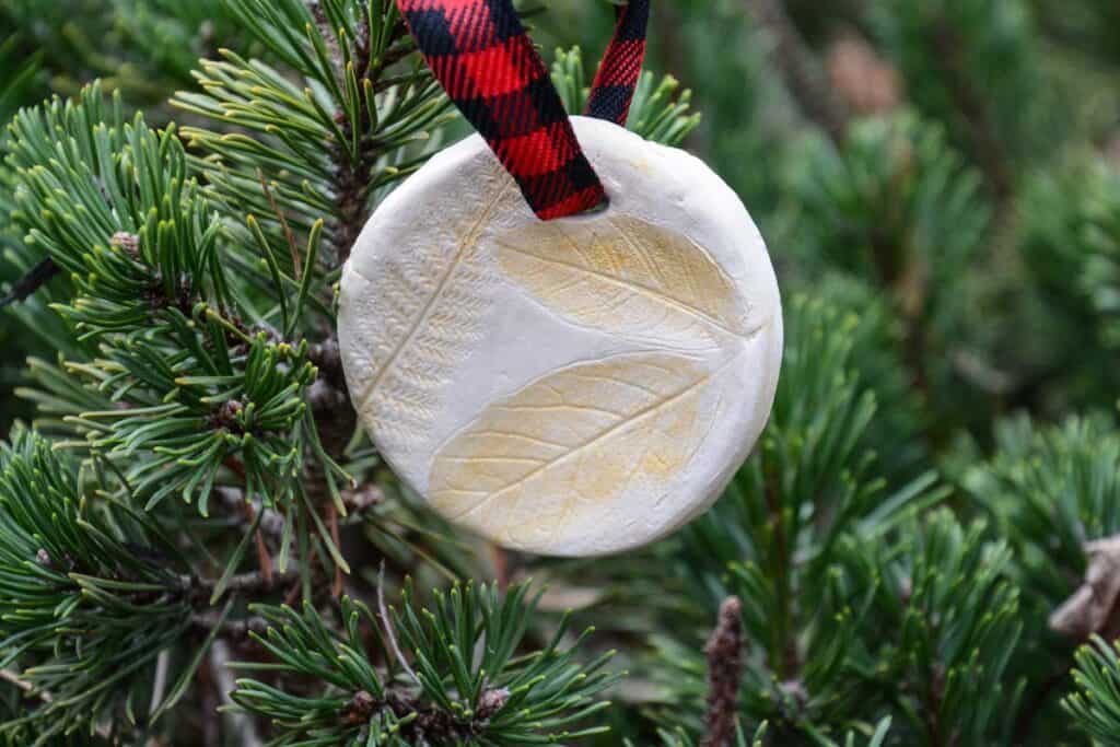 leaf impression painted gold on clay ornament.
