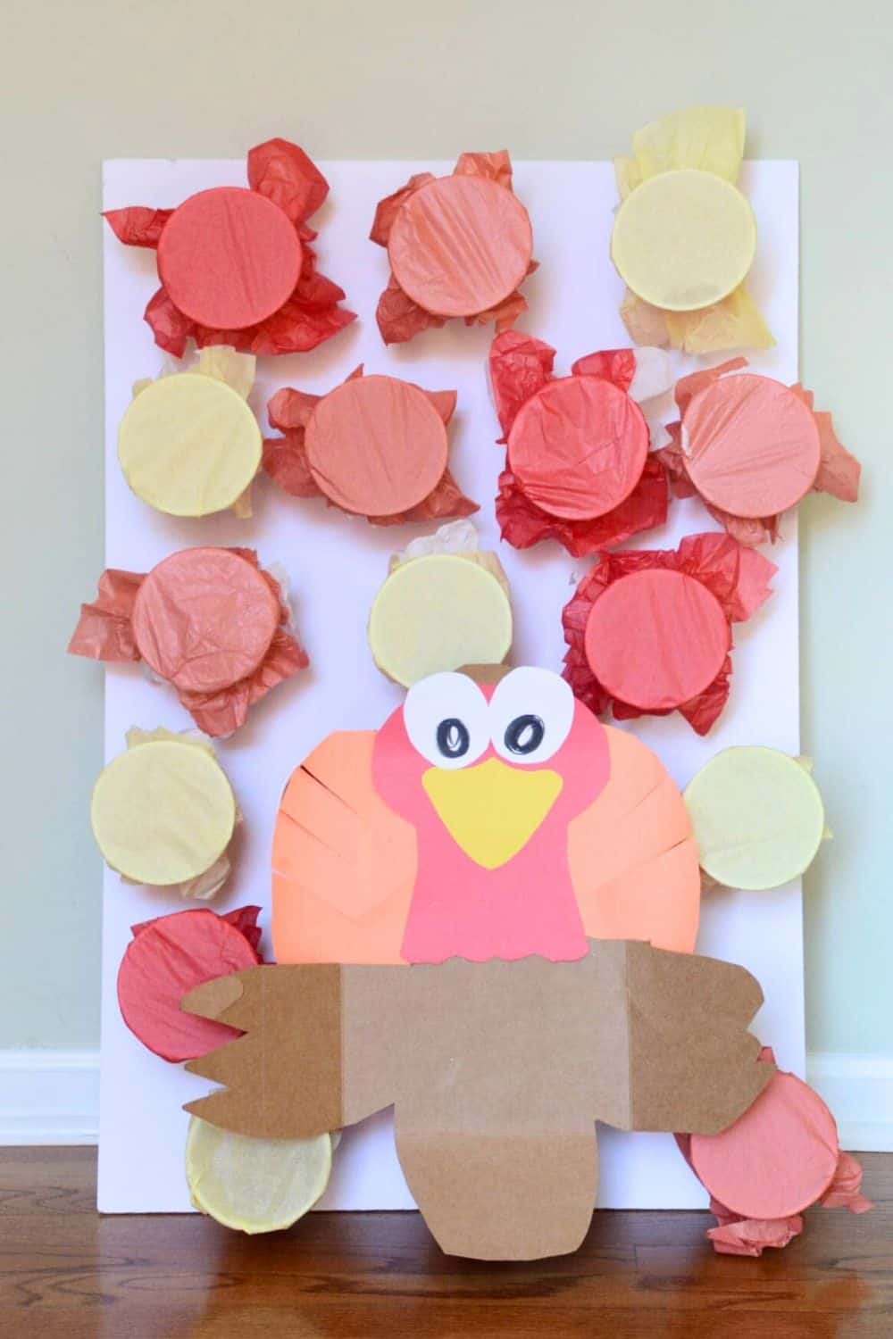 DIY turkey game for kids with tissue paper cups.