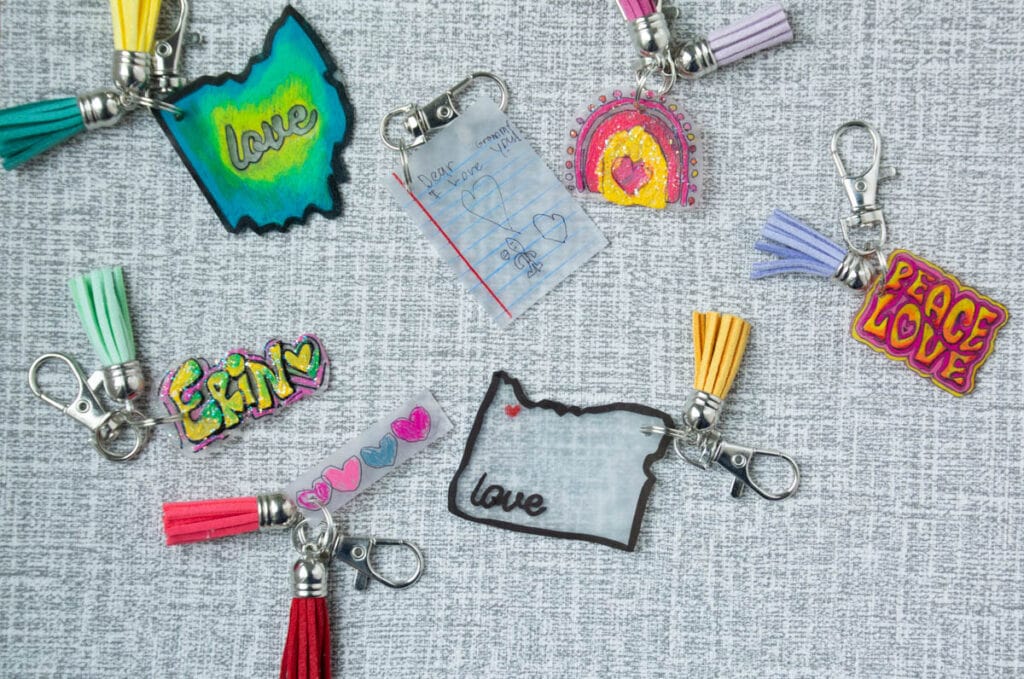 Shrink plastic keychain designs and shapes on table.