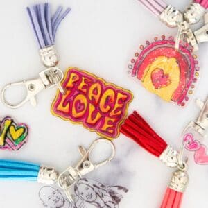 different DIY shrink plastic keychains on table.