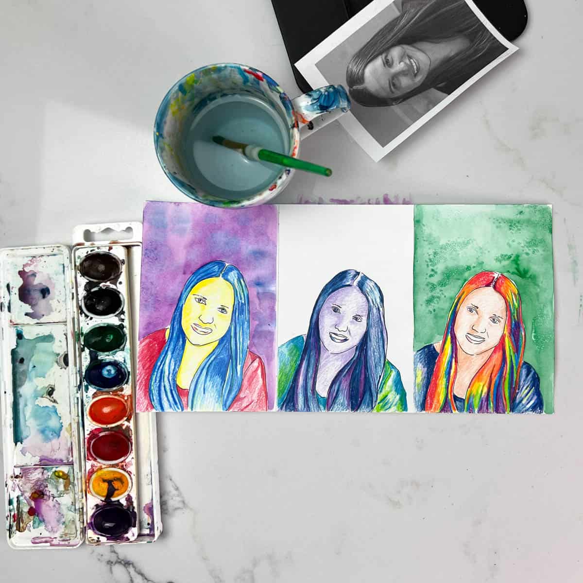 self-portrait art projects with watercolor paint backgrounds.