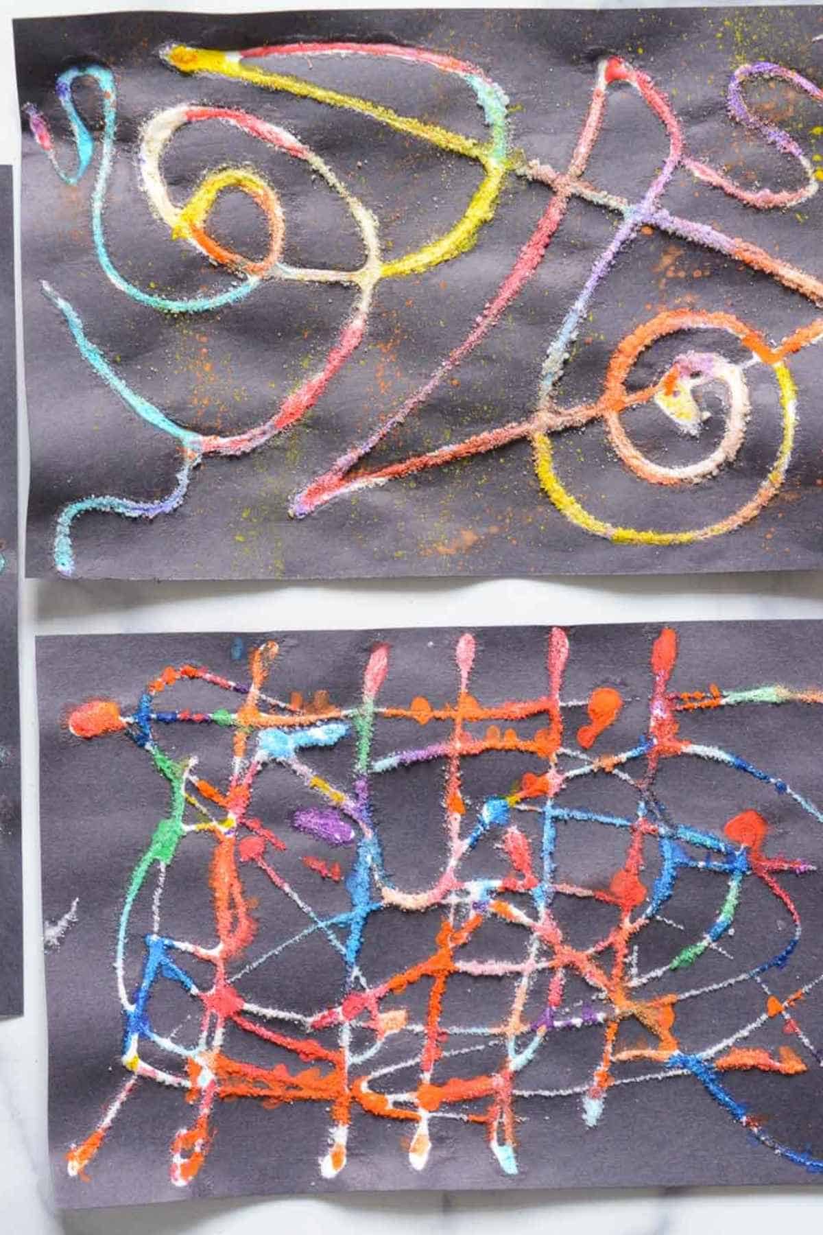 raised black salt glue lines with bright watercolor paints on it.
