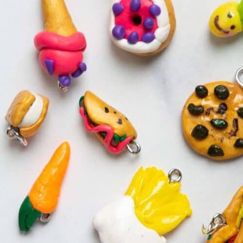 polymer clay charms of different foods on a table.