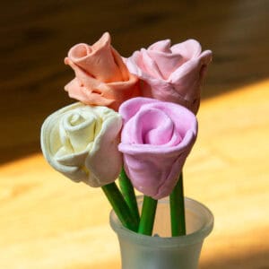 3-d clay roses in a vase.