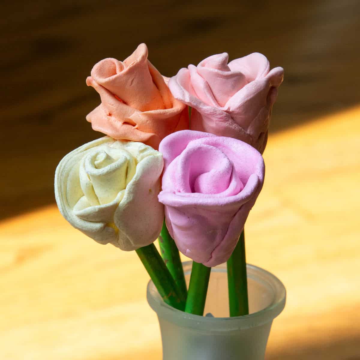 3-d clay roses in a vase.