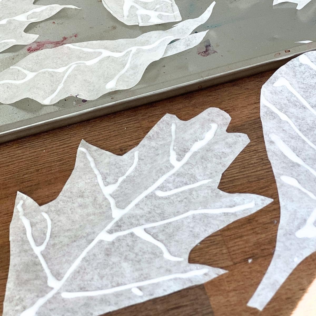 glue lines drawing on white paper leaf.