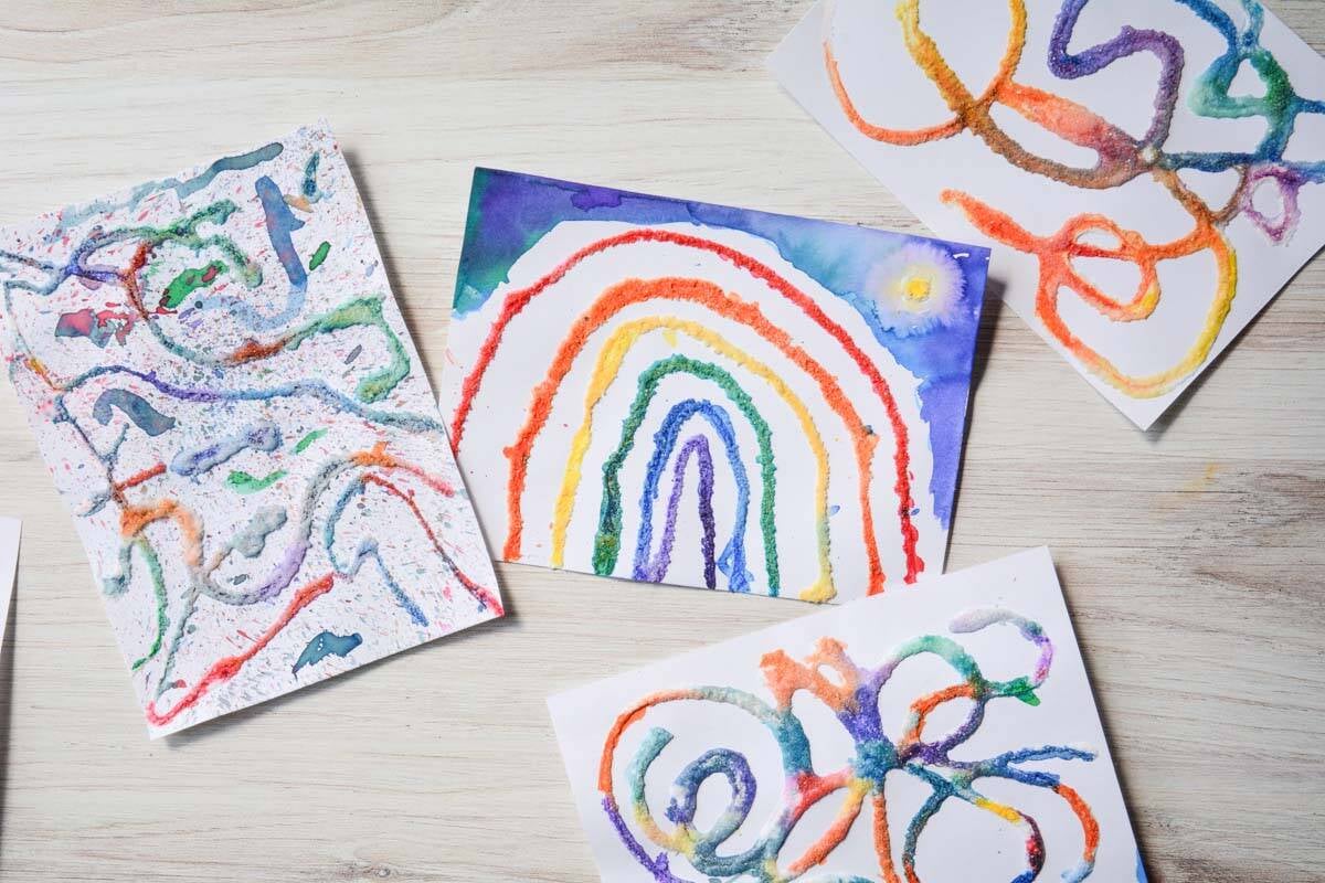 raised rainbow salt painting, abstract salt paintings on a table.