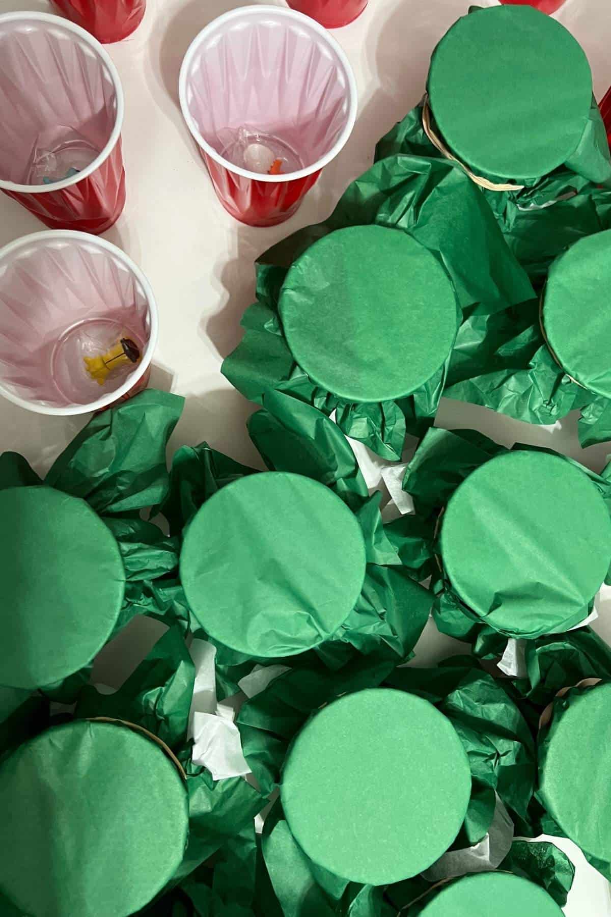 green tissue paper on cups.