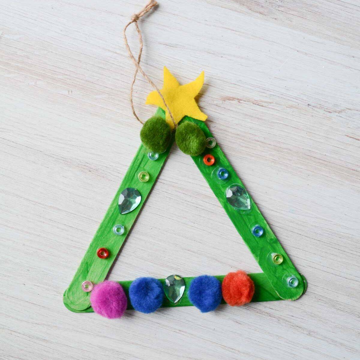 popsicle stick Christmas tree ornament with decorations.