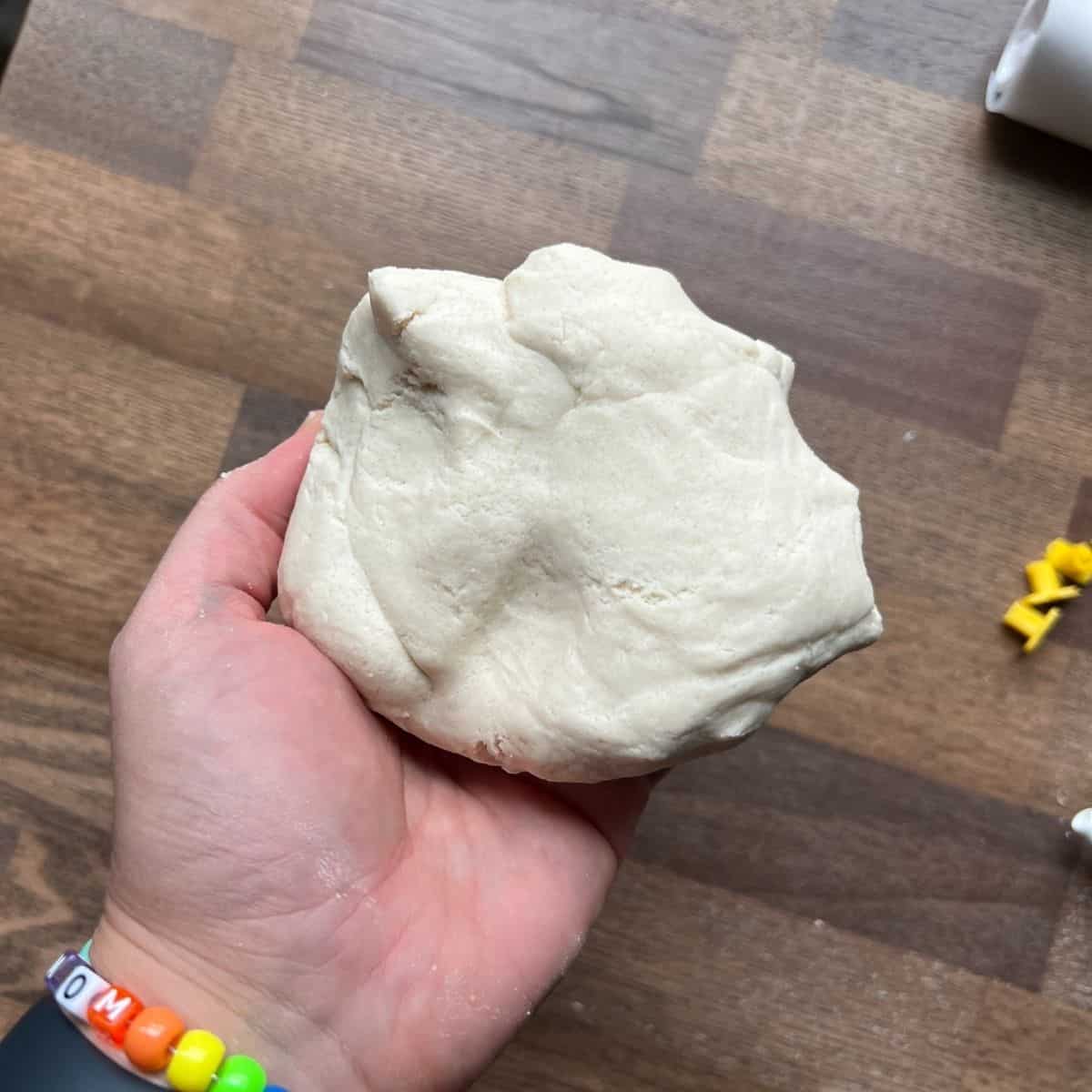 hand holding salt dough.