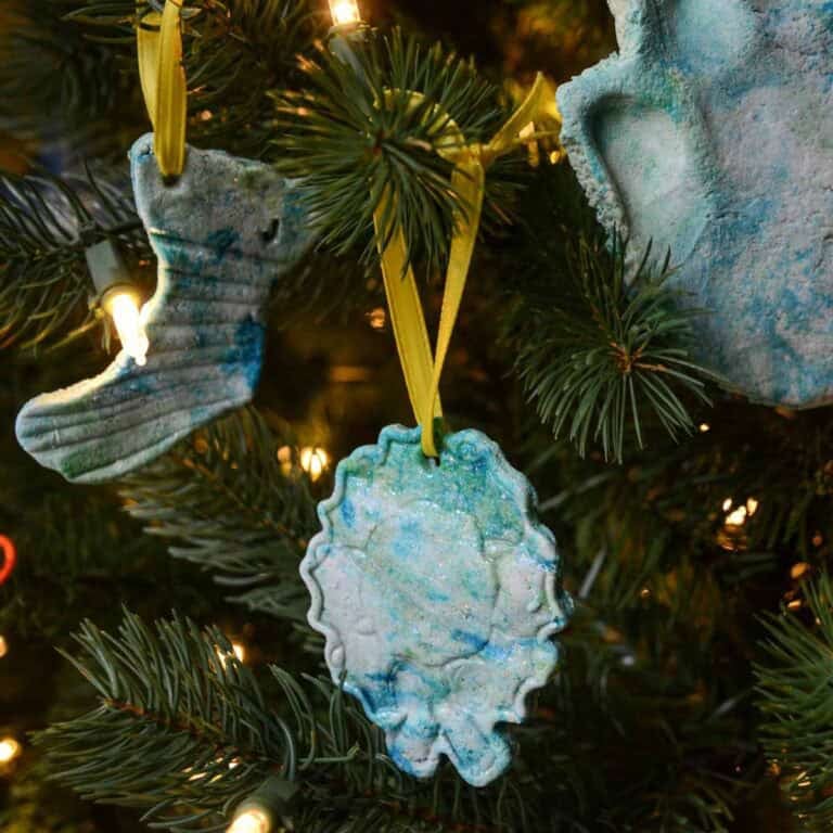homemade colored salt dough ornaments on a tree.