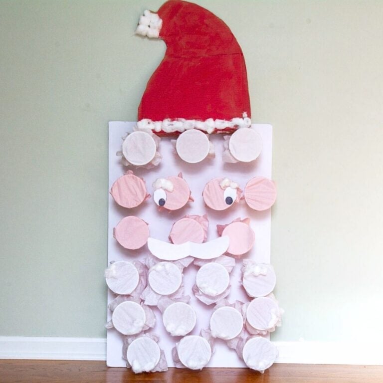 cups covered in tissue paper to make a Santa design Christmas punch game.