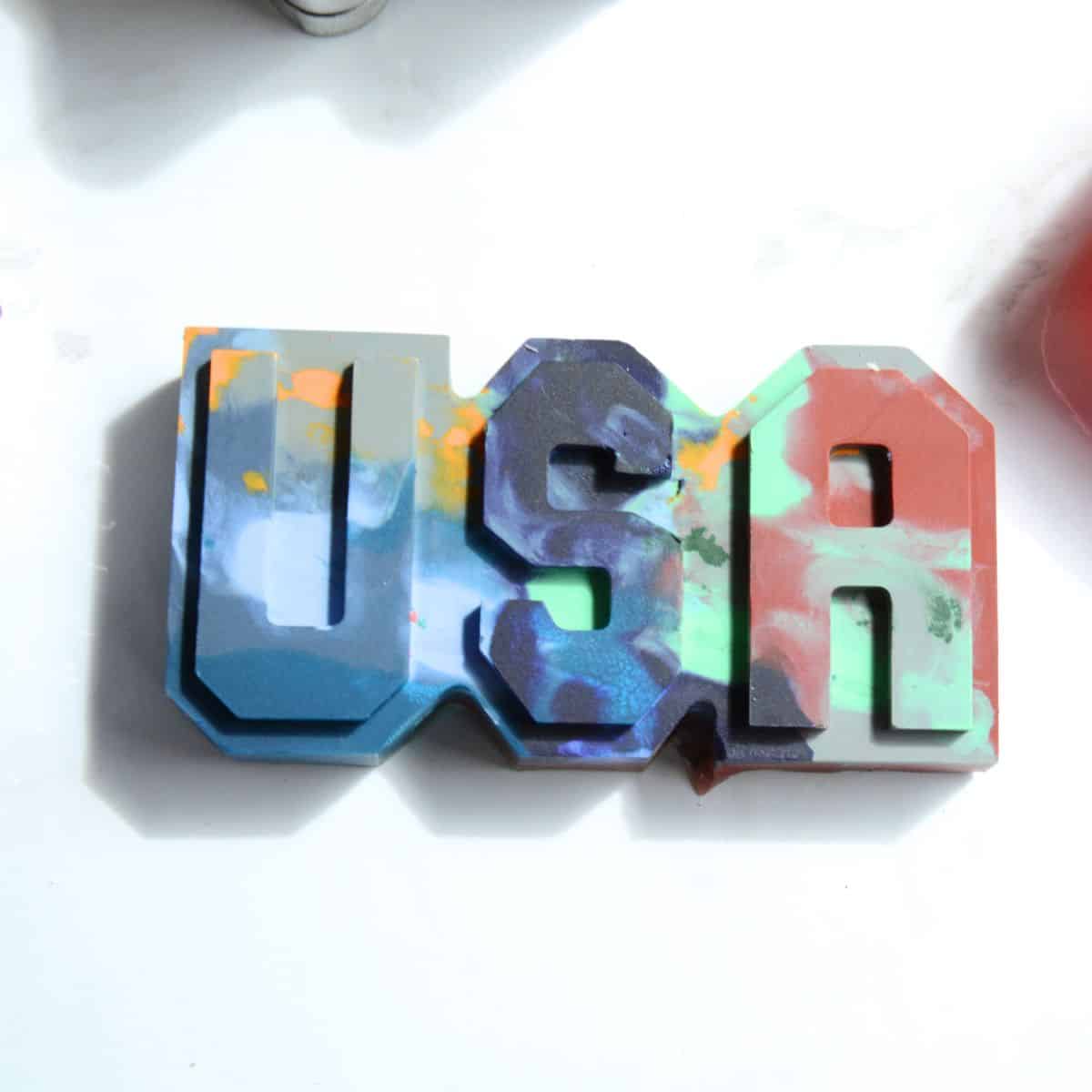 USA crayon on a white table.