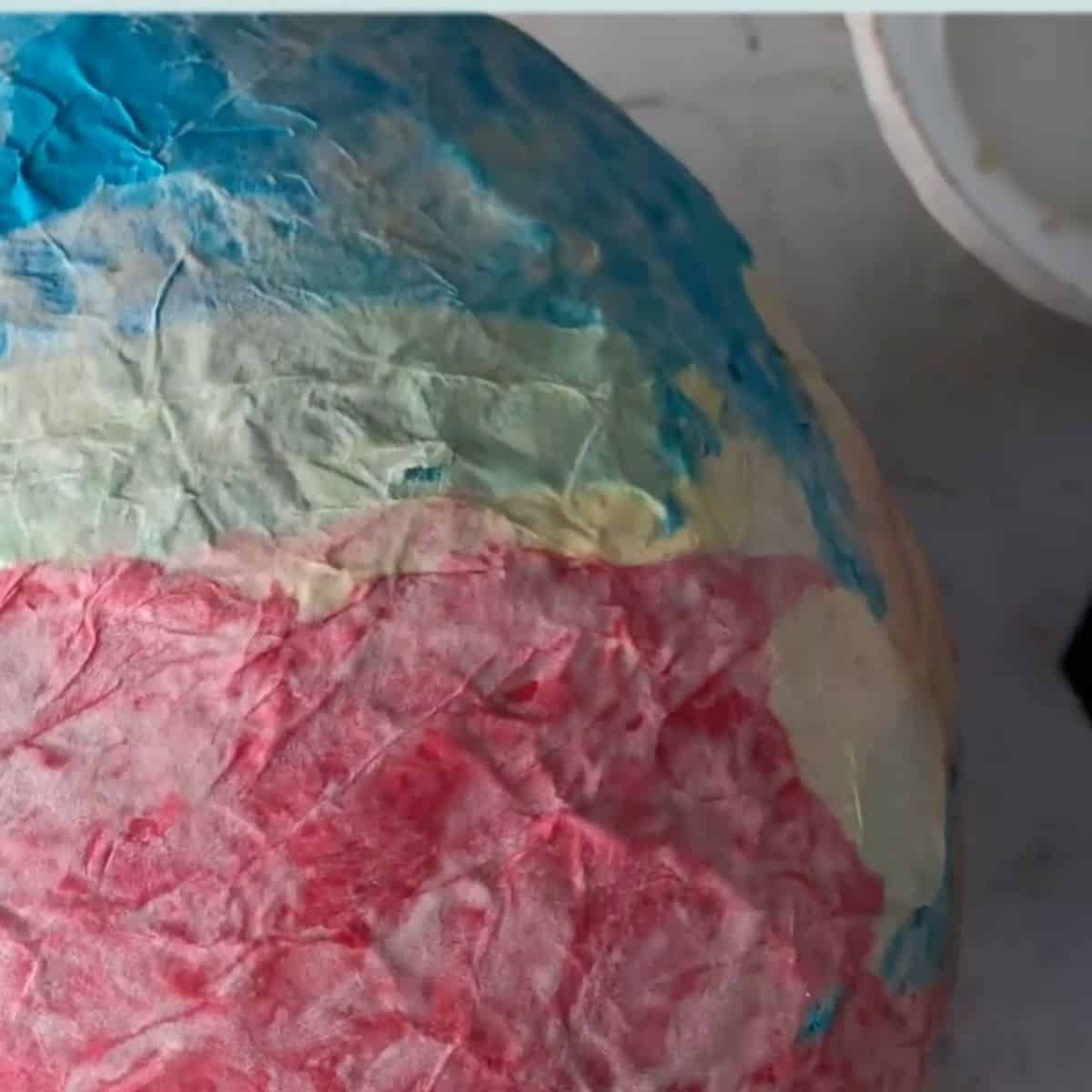 paper mache dried on a balloon.