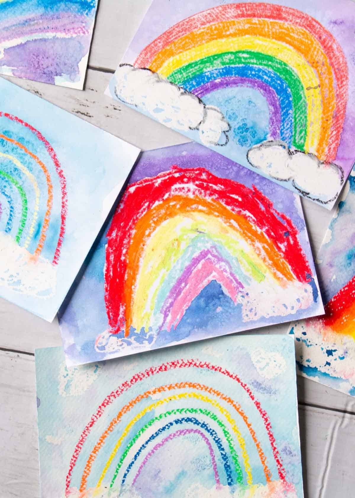 rainbow oil pastel and watercolor paintings made by kids.