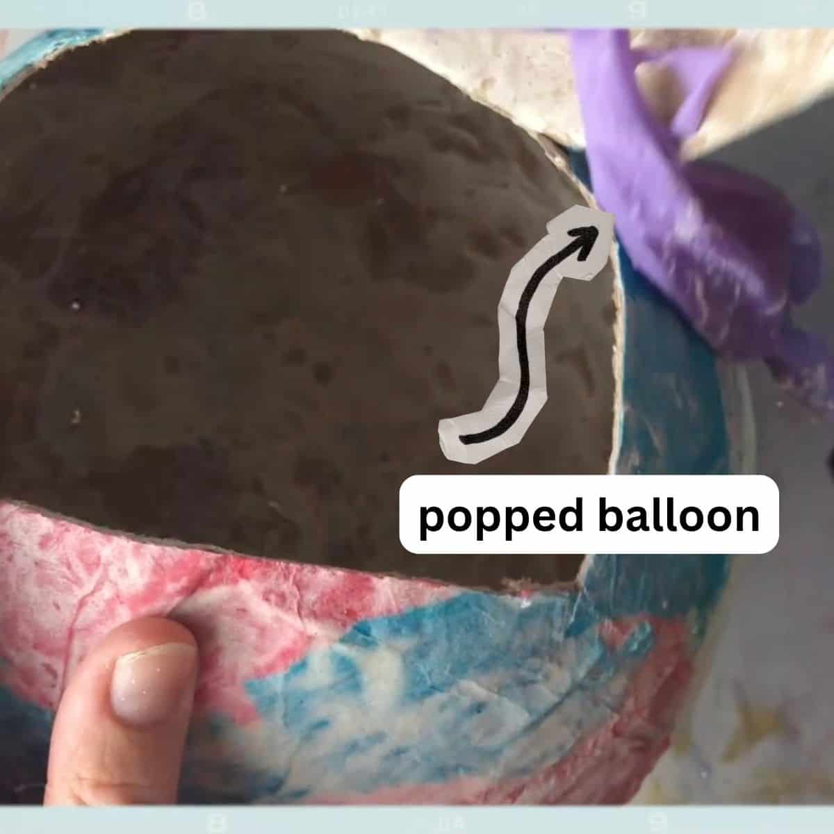 hand hold paper mache balloon pinata.