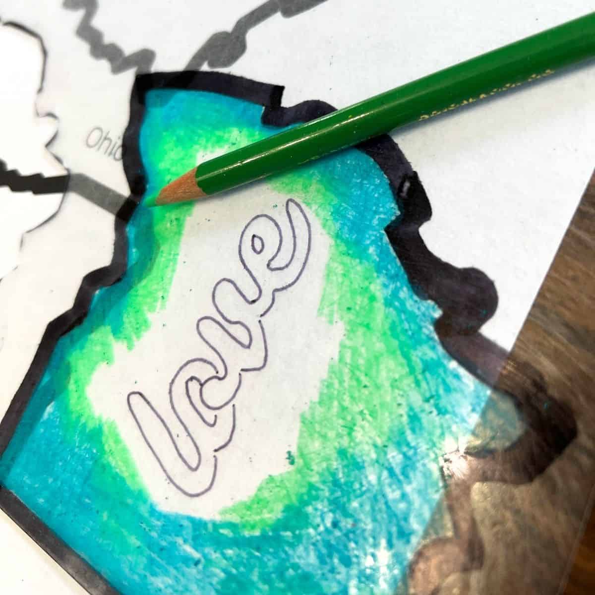 green colored pencil on a shrink plastic.