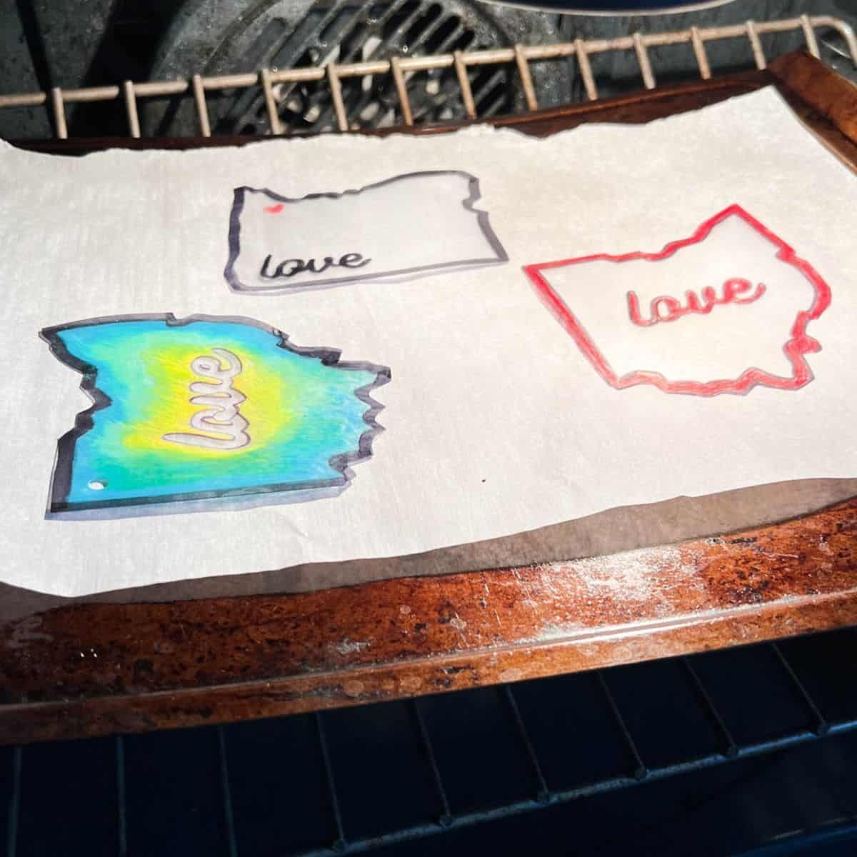 plastic state cutouts on baking sheet.