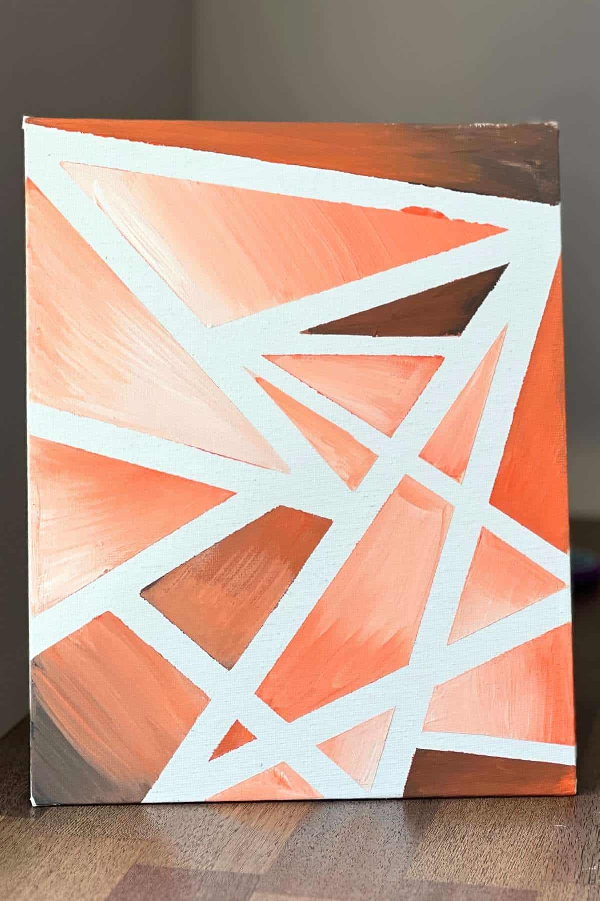 orange monochromatic tape resist canvas painting.