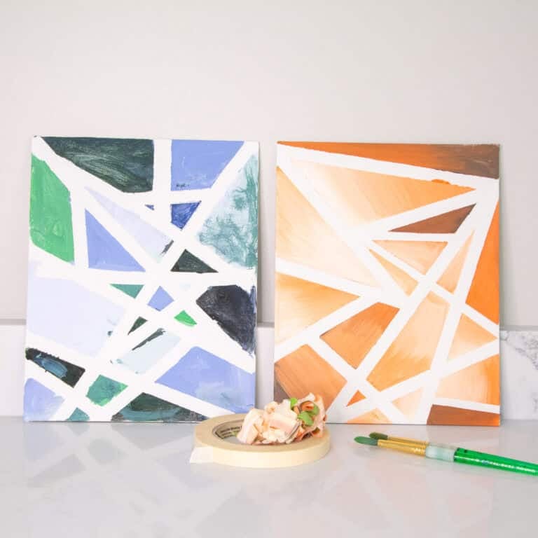 Abstract tape resist art on canvas showcasing tints and shades in green, blue, orange, and brown.