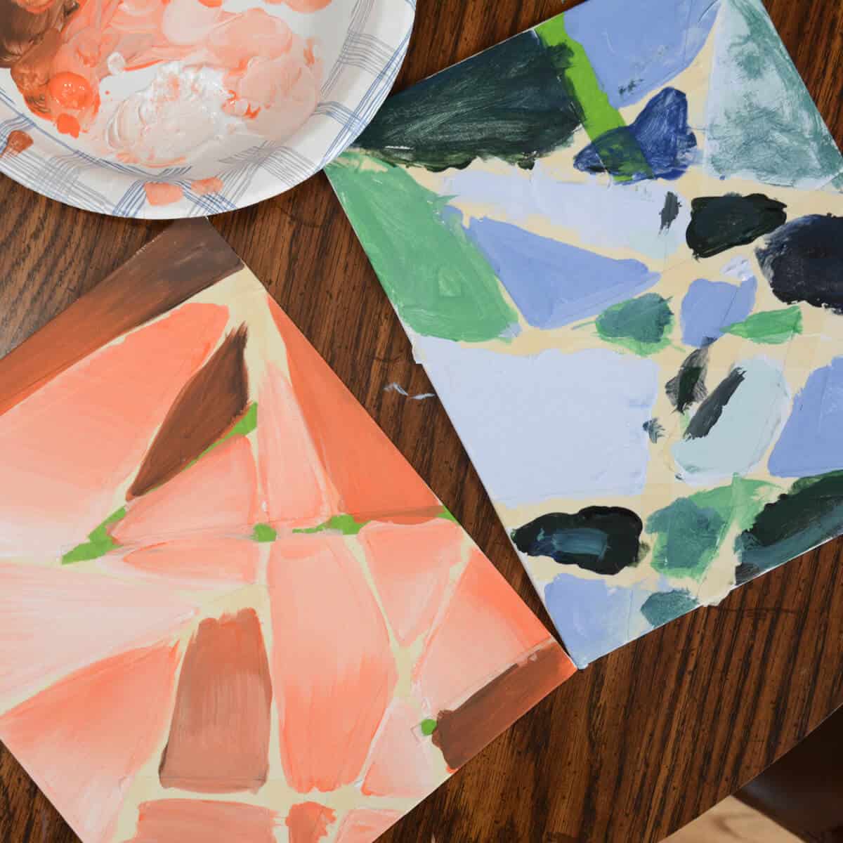 tape designs on painted canvas boards.