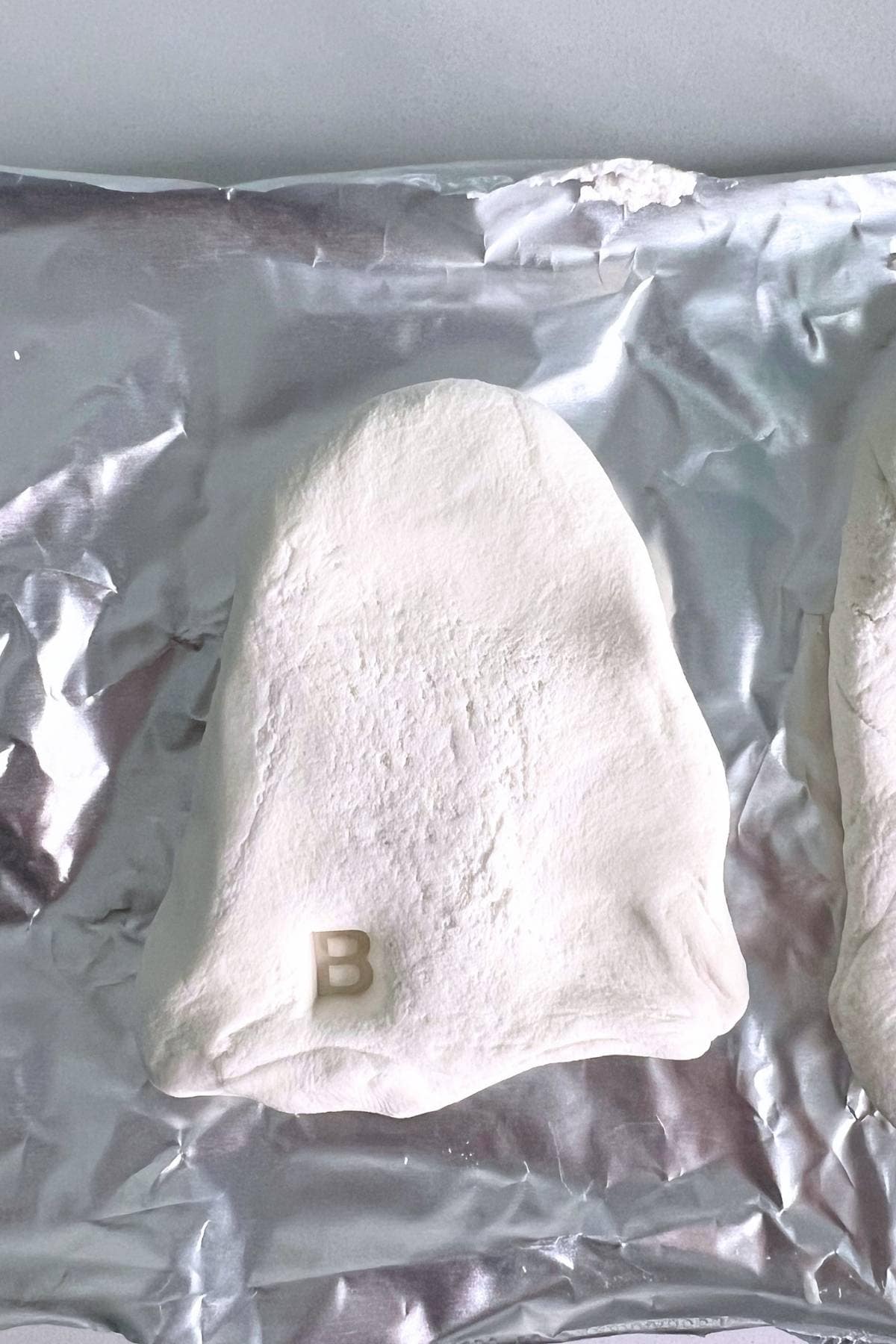 a letter B stamped in white dough.