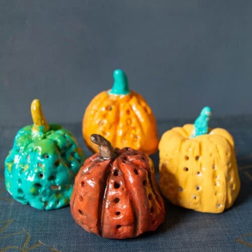 colorful painted clay pumpkin art projects.