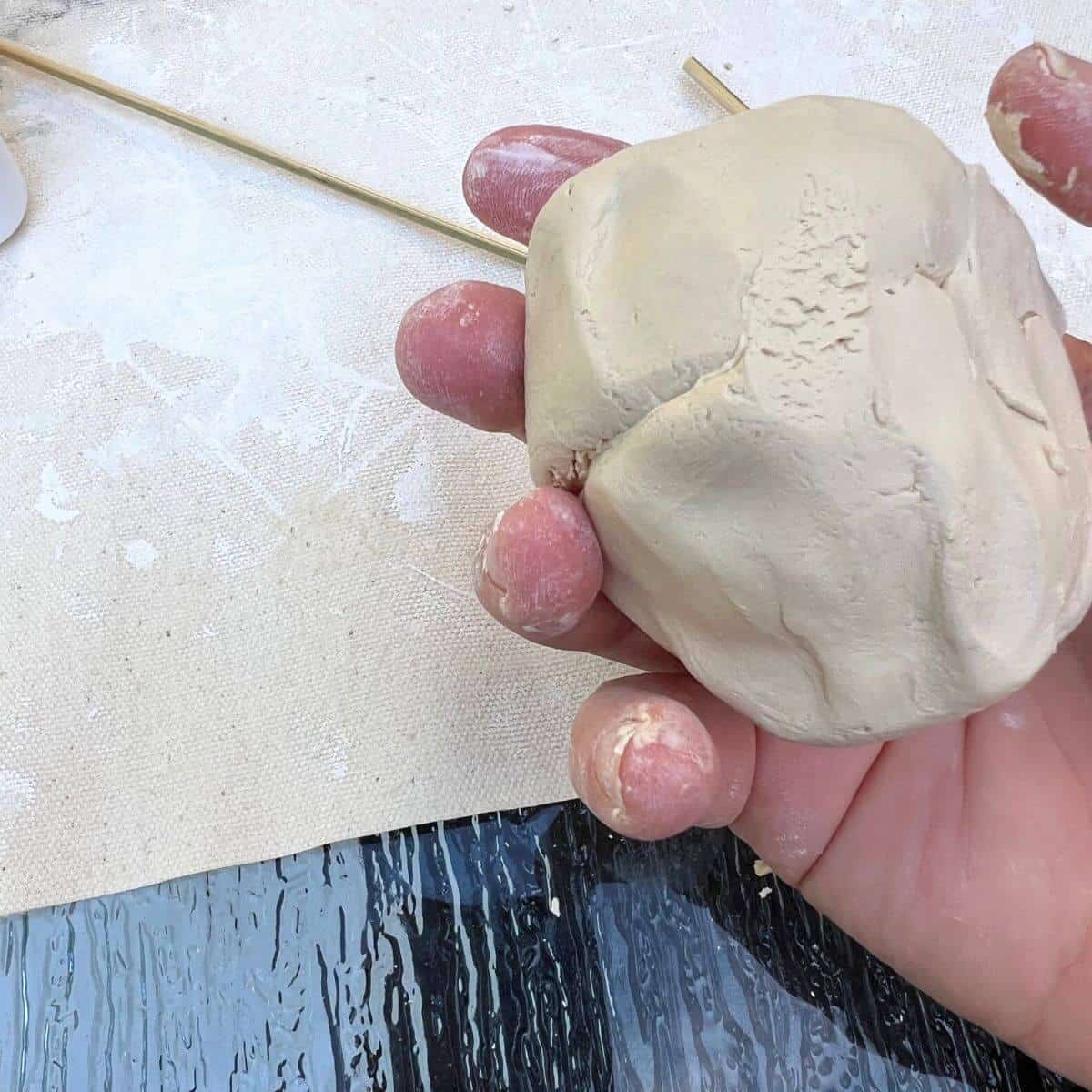 hand putting two pinch pots together.